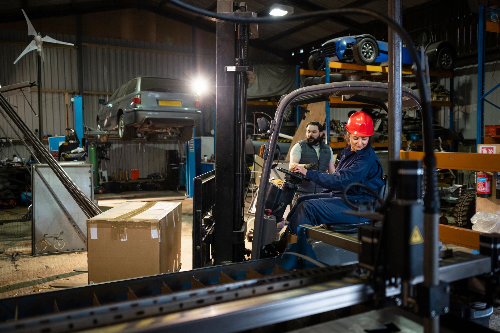 Manufacturing team working with forklift activity and inventory on the shop floor