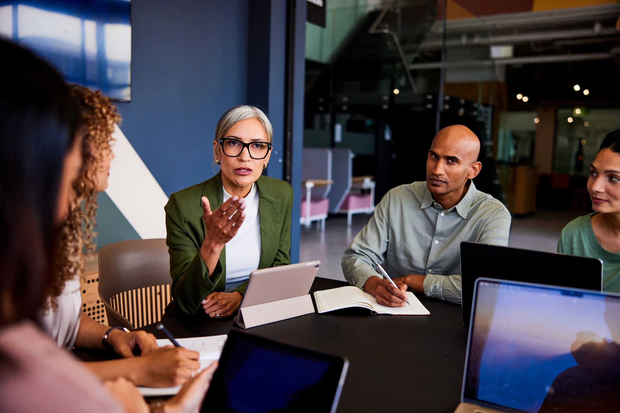 Consulting leader speaking during a team meeting